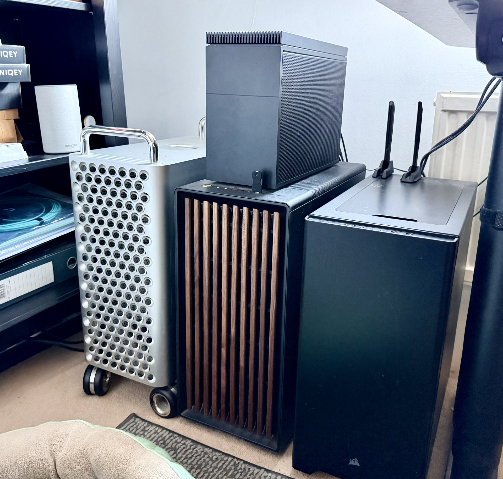 A picture of a new small PC on top of a much larger one